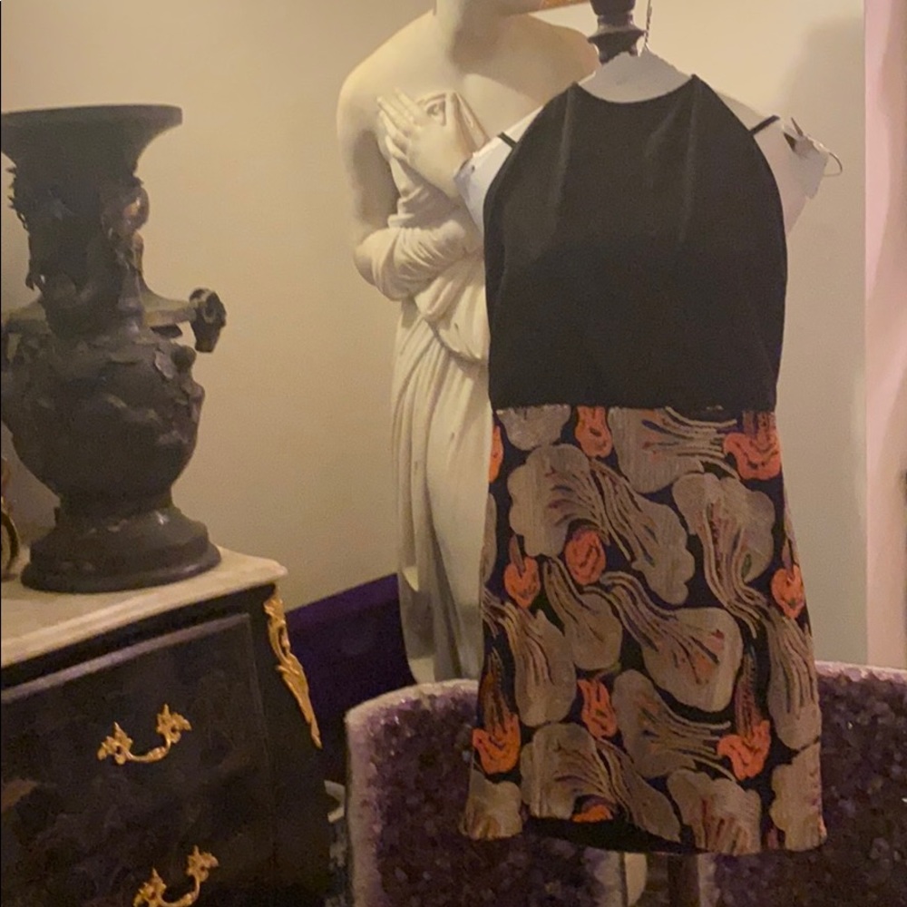 The bottom part of the dress is with sequins.